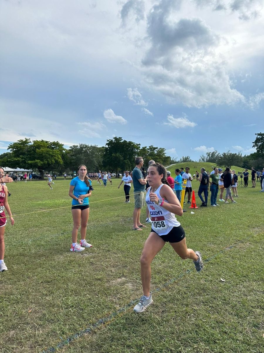 MAST Academy senior Mia Corbo runs in the King of the Hill Invitational at Tropical Park on Sept. 18, 2023.