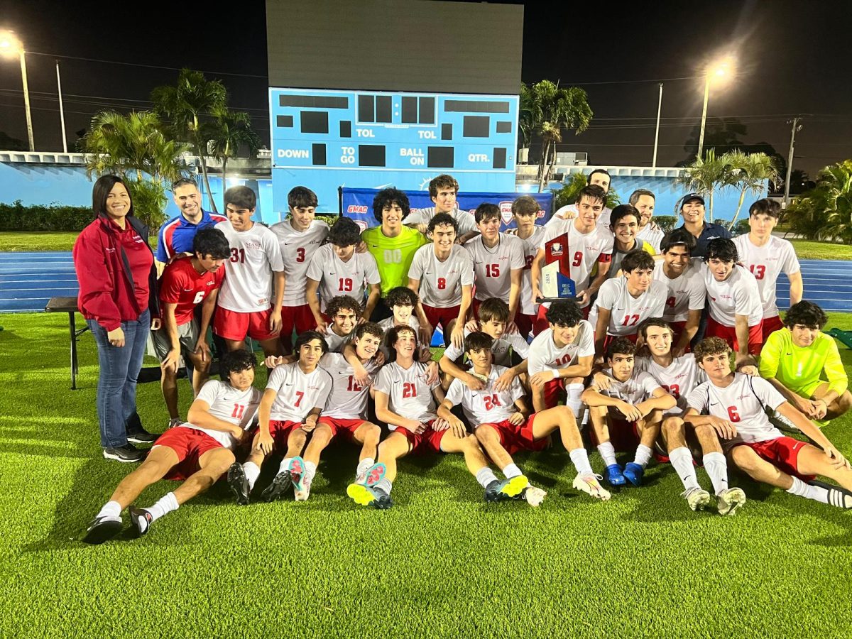 The+MAST+Academy+boys+soccer+team+poses+with+the+GMAC+trophy+after+defeating+Palmetto%2C+2-1.+Photo+via+Mr.+Couzo.